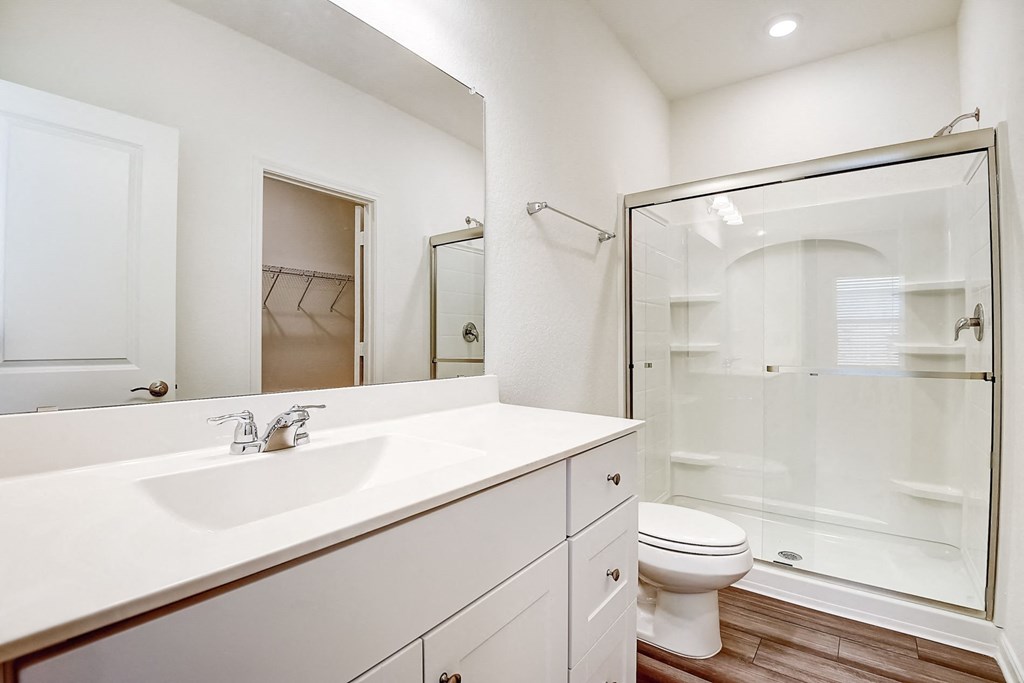 a bathroom with a toilet sink and shower at Beacon at Meridian, San Antonio, 78245