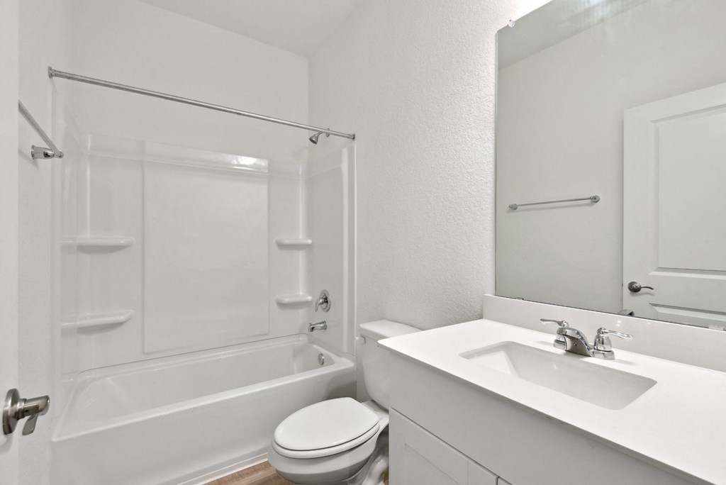 a bathroom with a sink toilet and bathtub