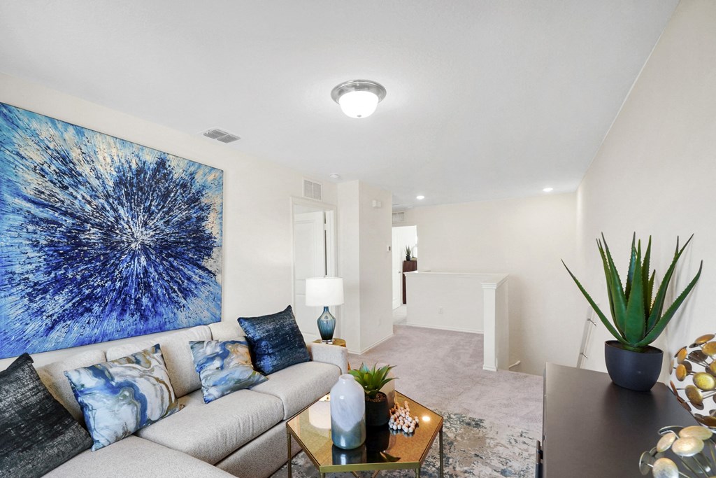 a living room with a couch and coffee table at Beacon at Meridian, San Antonio