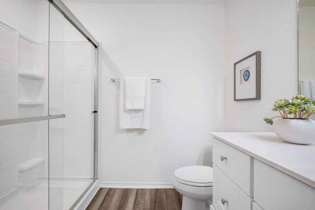 a bathroom with a toilet sink and shower at Beacon at Meridian, San Antonio, 78245