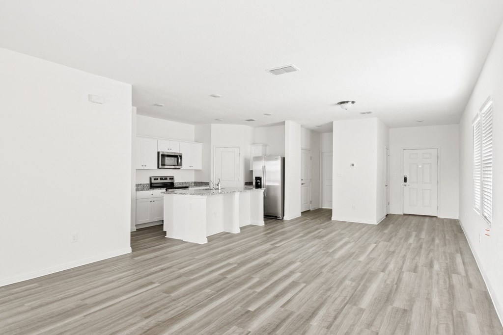 a kitchen and living room in Gingko floor plan at Beacon at Meridian, San Antonio, TX 78245