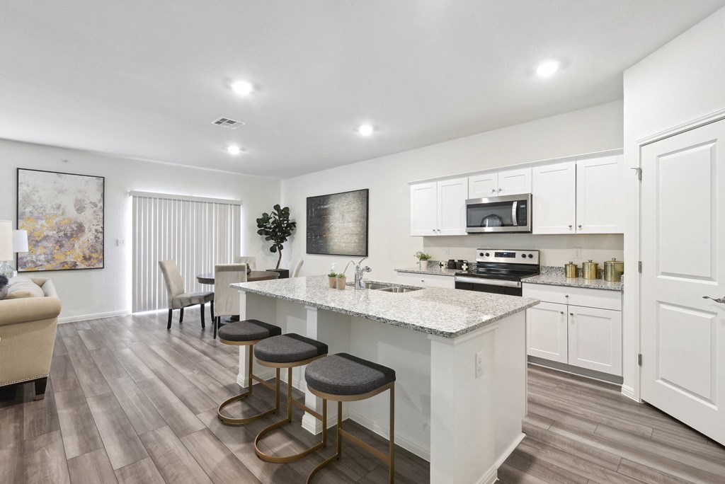 living room with kitchen and dining area