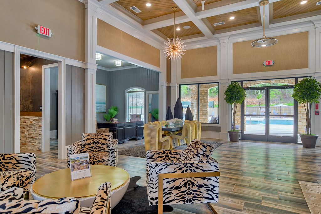 a living room with zebra print furniture and a pool
