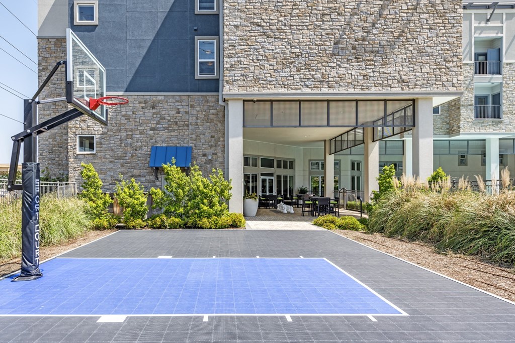 a basketball court in front of a building