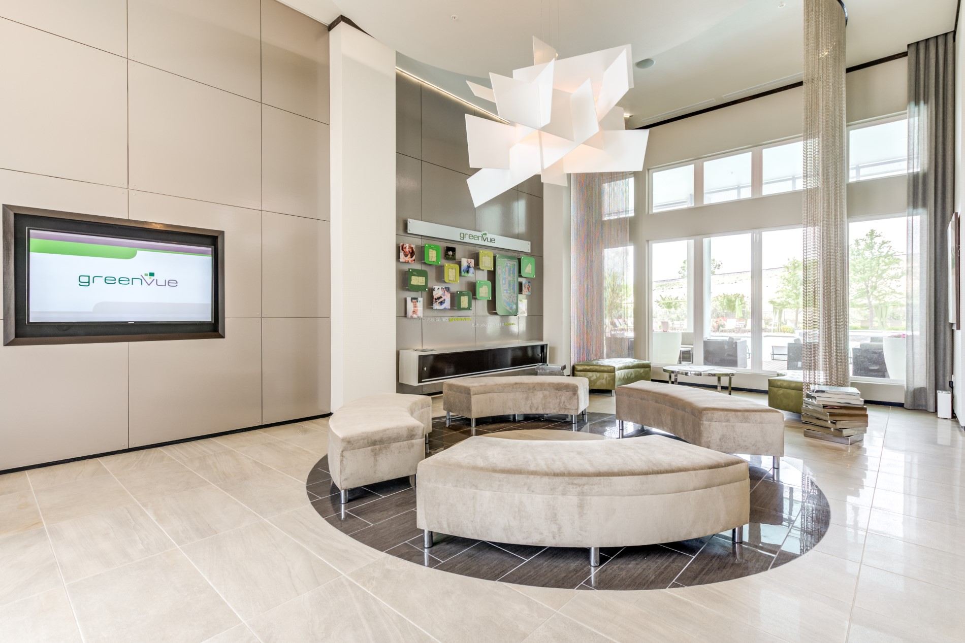 a living room with couches and chairs and a television