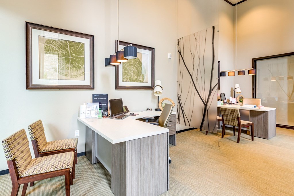 a conference room with a desk and chairs and a table