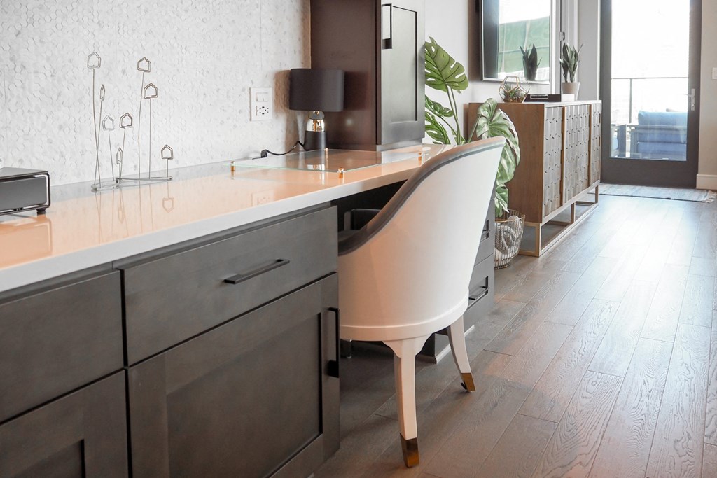 3-bedroom model built-in workspace with chair and lamp at The Hamilton apartments in Dallas, TX