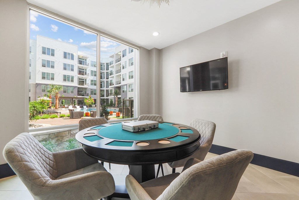a poker table and chairs at Harlow River Oaks in Houston, TX