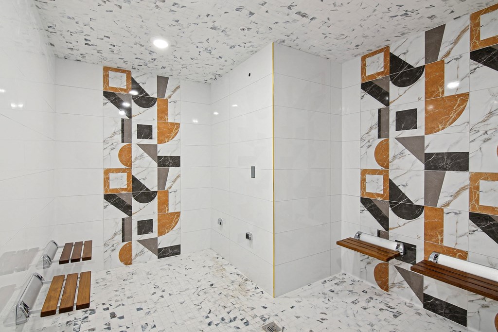 Steam room with tile geometric patterns on the wall at Hollywood Heights on the Boulevard Luxury Apartments in Hollywood FL