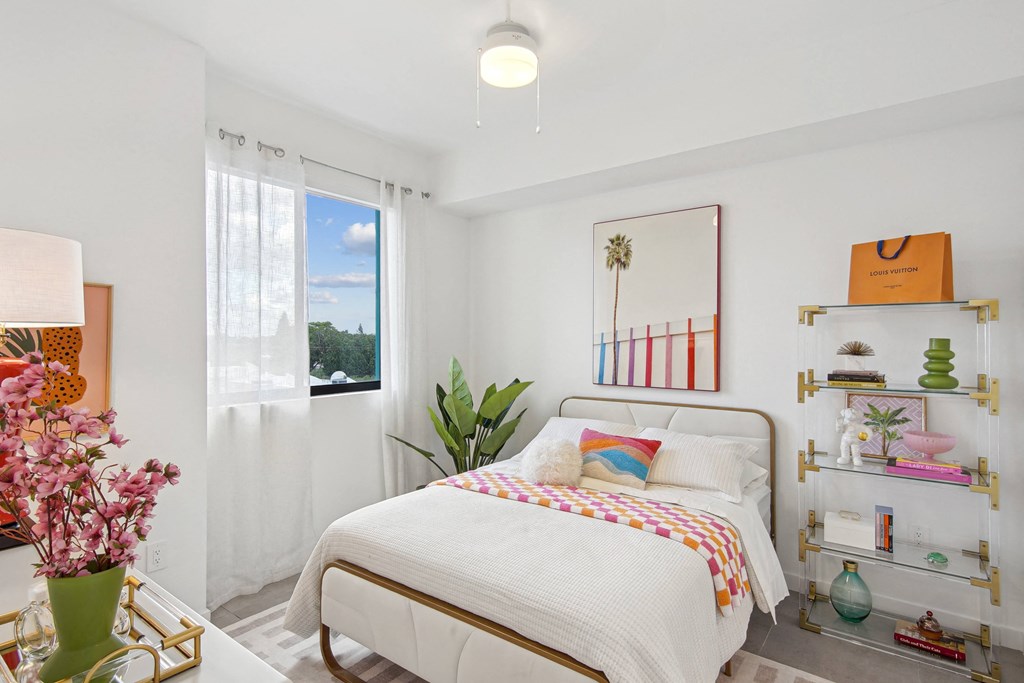 Second bedroom with a bed, nightstand in our 2-bedroom model at Hollywood Heights on the Boulevard Luxury Apartments in Hollywood, FL