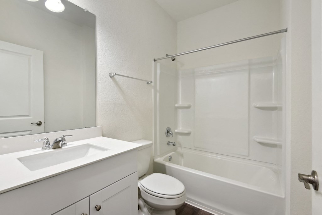 a bathroom with a sink toilet and bathtub