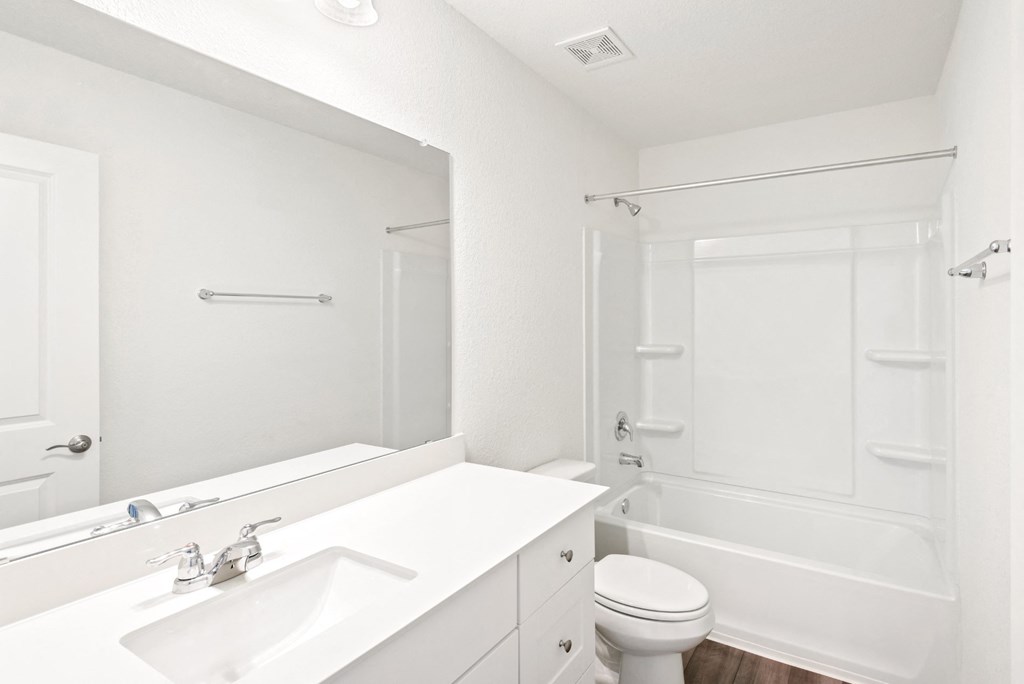 a bathroom with a sink toilet and bathtub