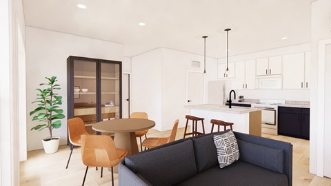A modern living room with a grey sofa and wooden chairs.