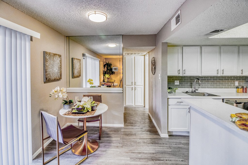 Model home dining area with table at Hillside Creek Apartments in Austin, TX
