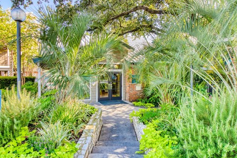 Front view of the leasing office at Hillside Creek Apartments in Austin, TX