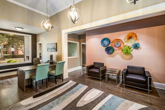 a resident clubhouse with a dining table and chairs