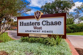 a sign for hunters chase west apartment homes