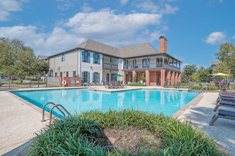 Pool behind the leasing office with poolside seating at Ultris Island Park in Shreveport, LA