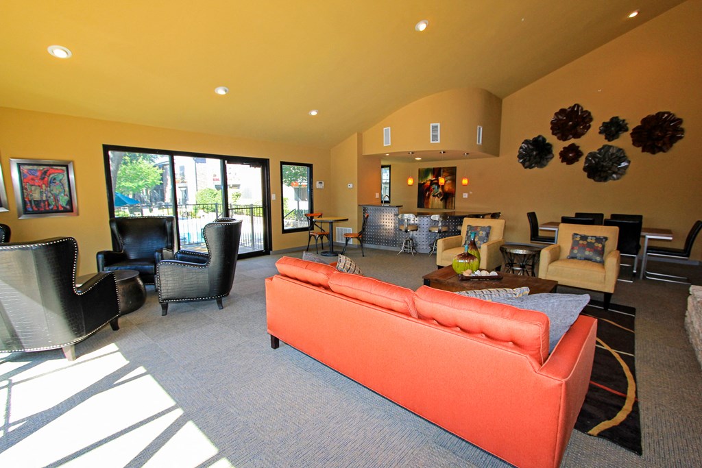 leasing office with an orange couch at Westdale Parke in Austin, TX