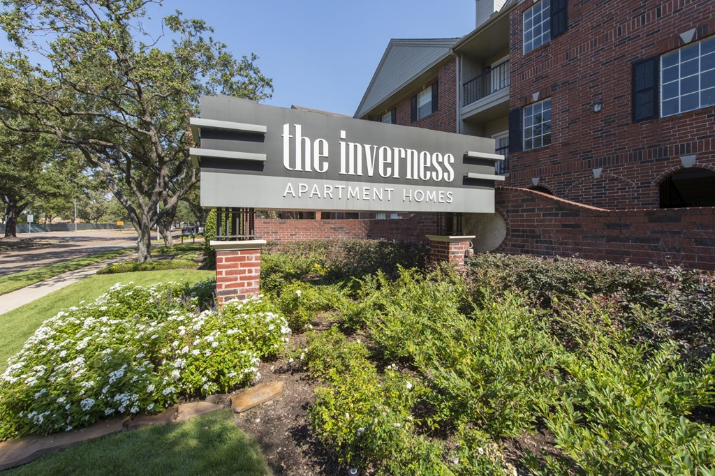 The Inverness Apartment Homes sign is displayed at the entrance of the apartment complex in Houston, TX