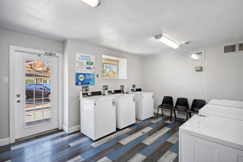 a laundry room at Johnston Creek Crossing in Charlotte, NC