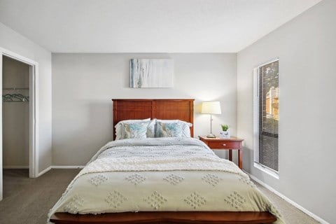 a bedroom with a bed and a window at Johnston Creek Crossing in Charlotte, NC