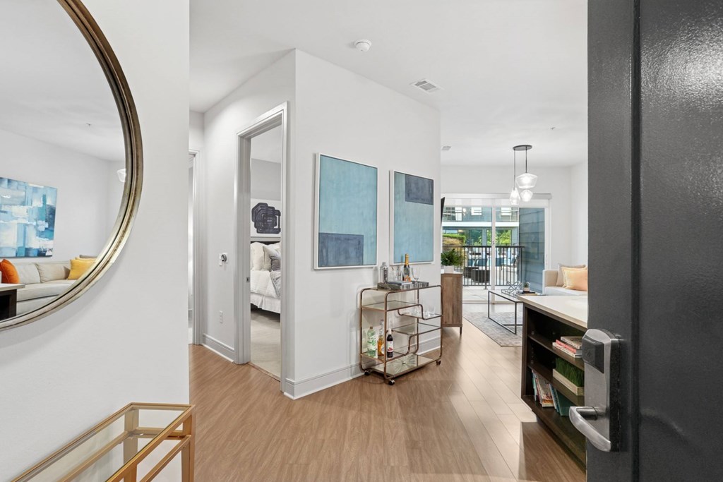 A modern entry way with wood floors at Knox Heights Apartments in Dallas, TX