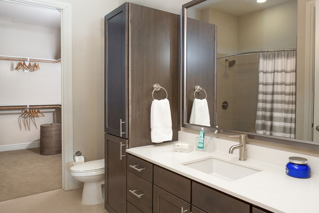 bright bathroom with a big mirror at Knox Heights in Dallas, TX