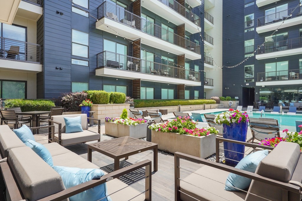 modern design poolside seating area at Knox Heights in Dallas, TX