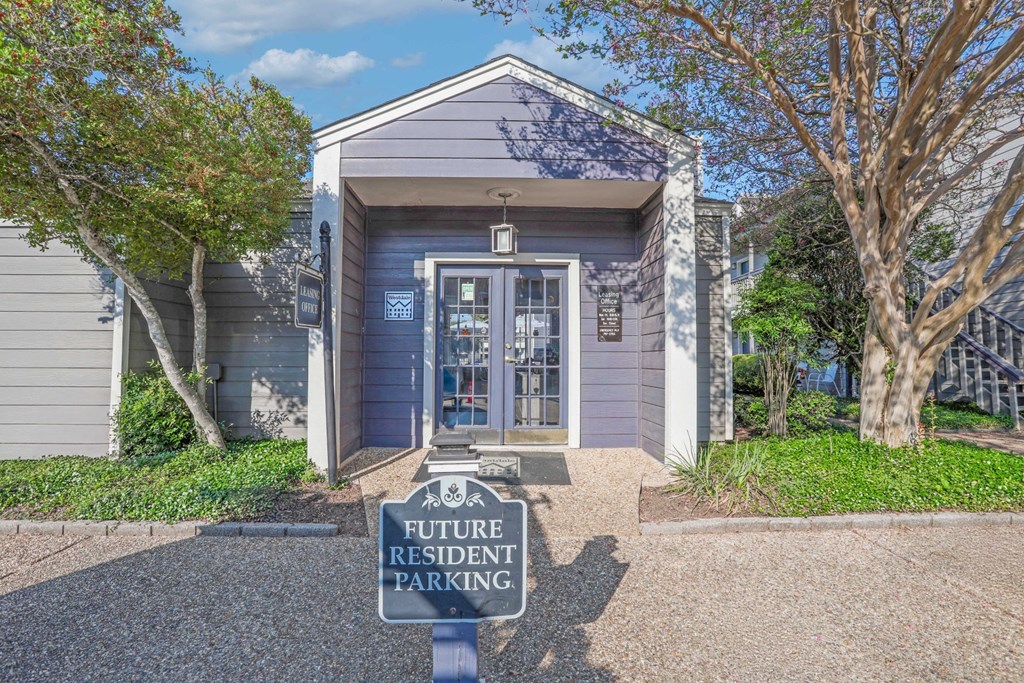 Front view of the leasing office with sign that says Future Resident Parking at Laurel Parc apartments in Shreveport, LA.