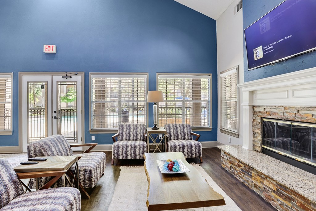 a living room with blue walls and a fireplace