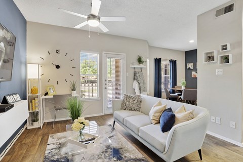 a living room with a large clock on the wall