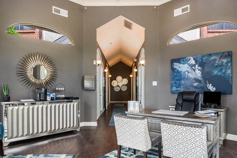 a dentist office with gray walls and a large mirror on the wall