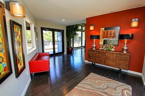 Interior of leasing office with red couch at Westdale Parke Apartments in Austin, Texas, TX