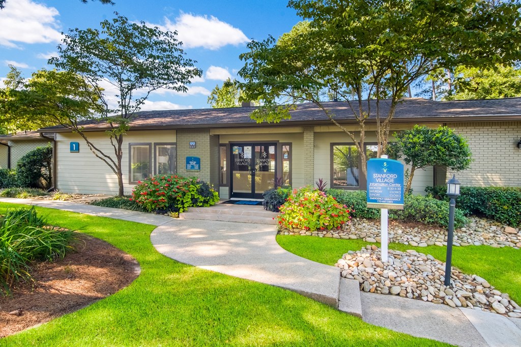 a building with a blue sign in front of it
