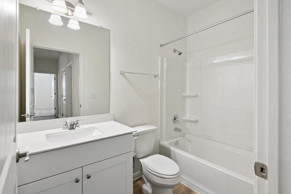 a bathroom with a sink toilet and bathtub