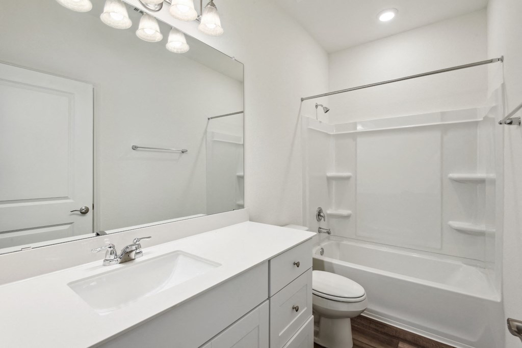 a bathroom with a sink toilet and bathtub