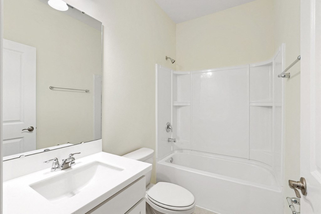 a bathroom with a sink toilet and bathtub