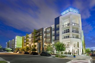 a rendering of an apartment building at night