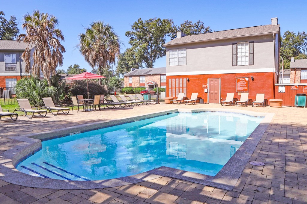 our apartments have a resort style pool and lounge chairs