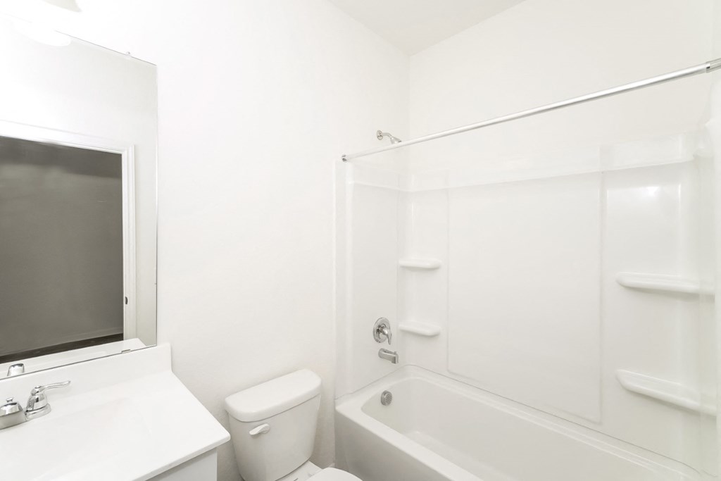 a bathroom with a bathtub and a sink at Beacon at Meridian, San Antonio, TX