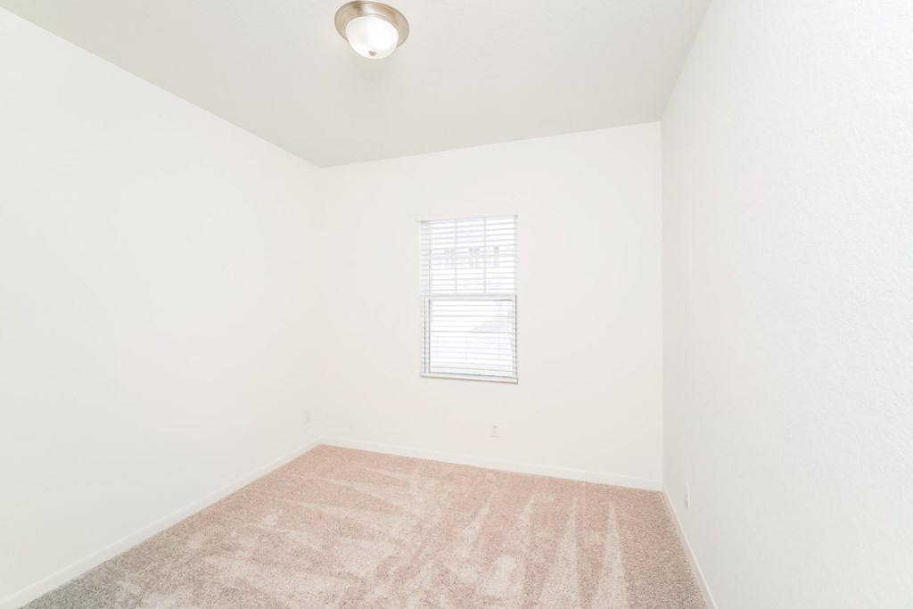 a bedroom with white walls and carpet at Beacon at Meridian, San Antonio, TX 78245
