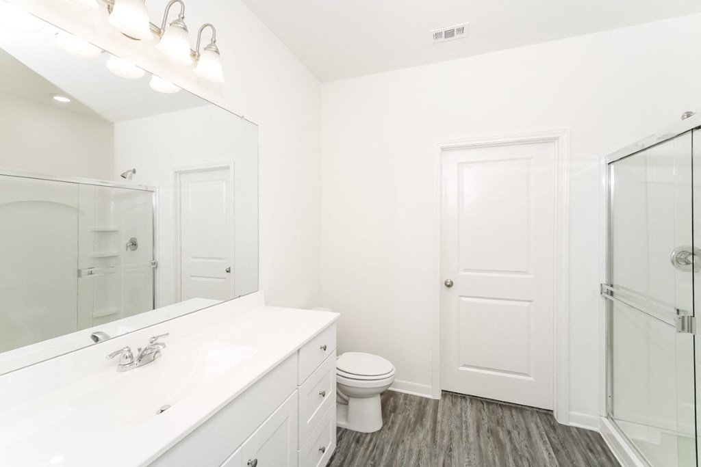 a bathroom with a toilet and a sink at Beacon at Meridian, San Antonio, TX 78245