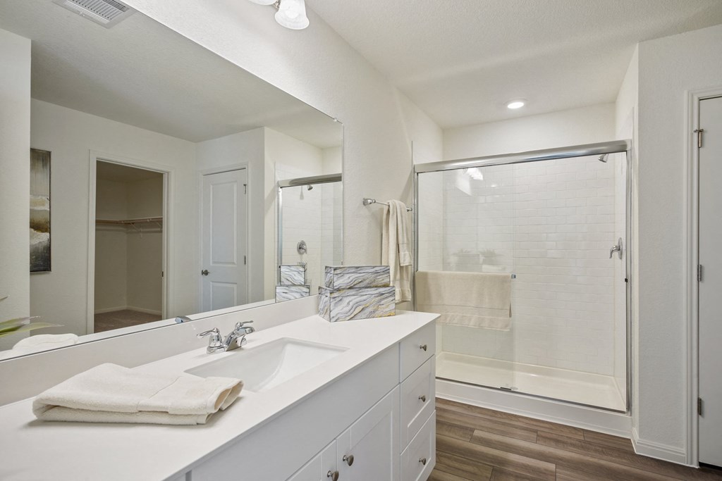 Maple model master bathroom with a large mirror and a shower at Beacon at Ashley River Landing in Summerville, SC