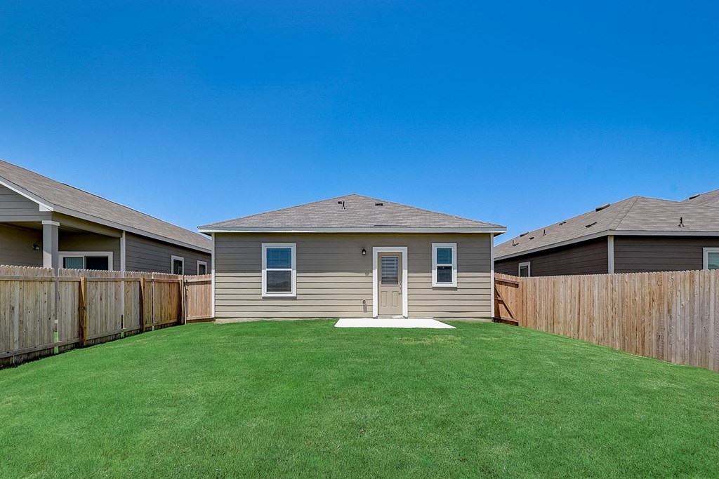 the backyard of a home at the cliffs at keowee falls south new lakefront home at Beacon at Meridian, Texas, 78245