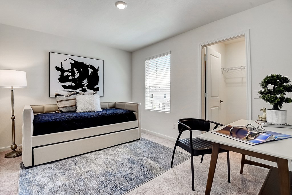 a bedroom with a bed and a desk at Beacon at Meridian, Texas