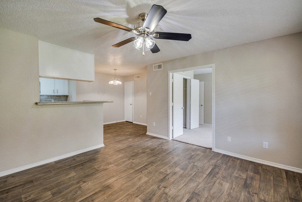 Living Area with Ceiling Fan at Bookstone and Terrace Apartments in Irving, Texas
