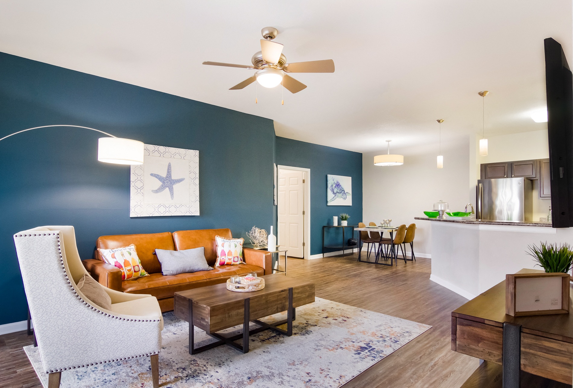 a living room with blue walls and a couch and a table
