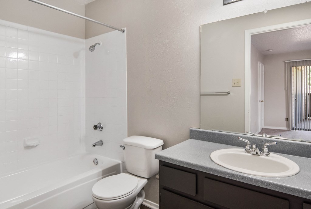 the preserve at ballantyne commons apartment bathroom with sink toilet and shower