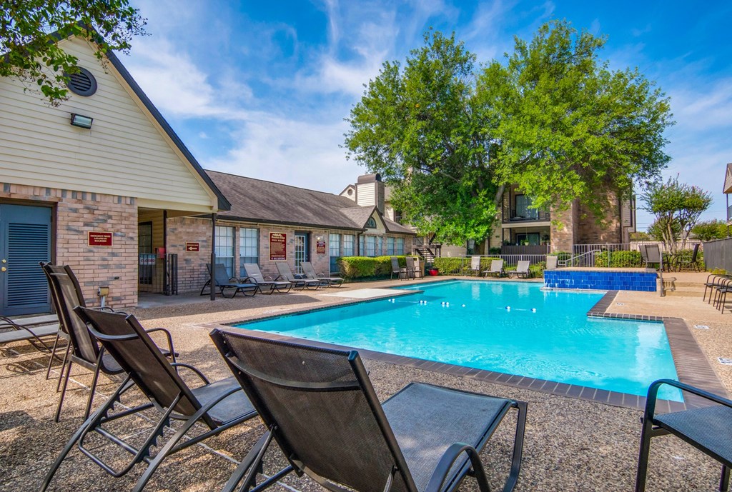 our apartments offer a swimming pool with chairs around it